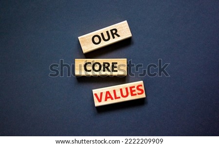 Our core values symbol. Concept words Our core values on wooden blocks on a beautiful black table black background. Business value and our core values concept. Copy space.