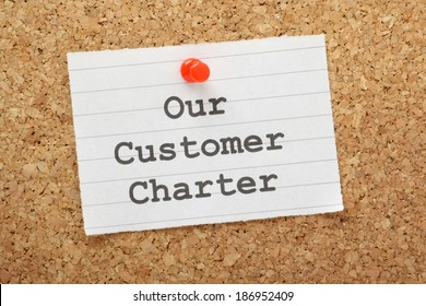 Our Customer Charter Reminder Pinned To A Cork Notice Board. A Charter Enables Businesses To Set Out Their Core Values And Commitments On Delivery And Service To The Customer