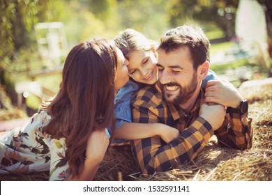 Our Family Is Our First Priority. Family Having Fun In Nature.