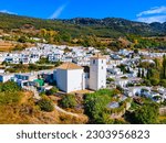 Our Lady of the Rosary Church aerial panoramic view in Bubion. Bubion is a village in the Alpujarras area in the province of Granada in Andalusia, Spain.