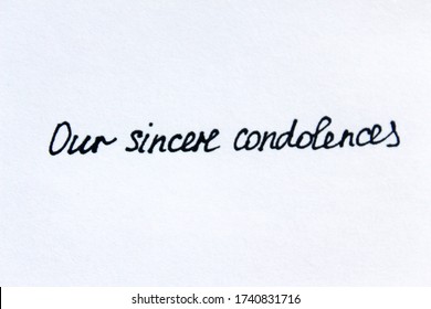 Our Sincere Condolences. Handwritten Message On A White Background.