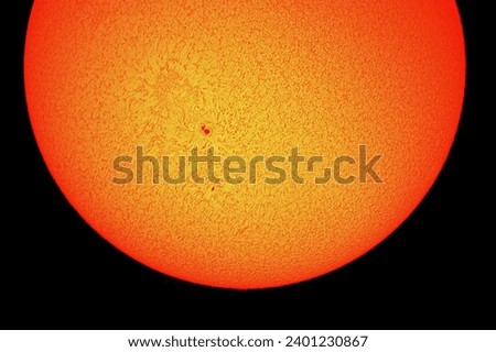 Our sun with its surface viewed through a hydrogen alpha telescope.