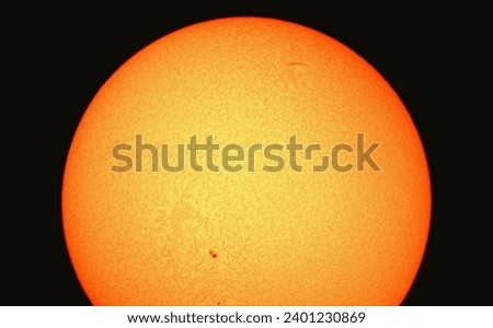 Our sun with its surface viewed through a hydrogen alpha telescope.