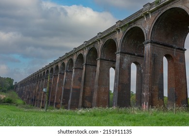 Ouse Valley viaduct. Railway bridge built in 1839 still in service today on the mainline between Brighton and London. West side looking south from low angle. - Powered by Shutterstock