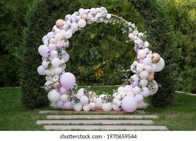 Ouside Wedding Ceremony. Balloon Wedding Arch In The Garden. Wedding Day.