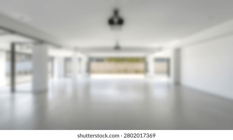 Out of focus background of large empty modern room with white walls and tiled floor