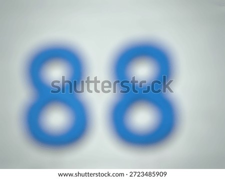 Out of focus blue number eighty eight on a clean white background. Minimalist abstract numeric concept for birthdays, anniversaries, or mathematical design elements.