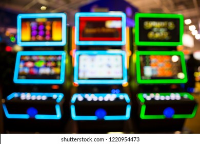 Out Of Focus Blurry Image Of Casino Equipment. Blurred Slot Machines In A Casino.