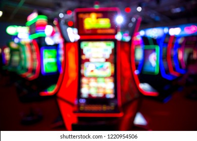 Out Of Focus Blurry Image Of Casino Equipment. Blurred Slot Machines In A Casino.