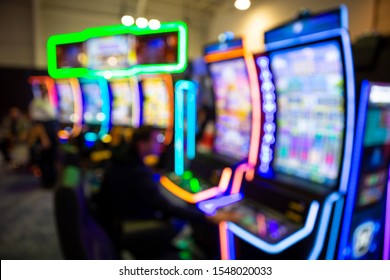 Out Of Focus Blurry Image Of Casino Equipment. Blurred Slot Machines In A Casino.