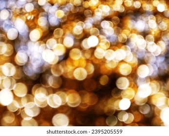 Out of Focus, Defocused, Blurred, Abstract and Bokeh of Sparkling Gold Lights, Suitable for Background Use - Shutterstock ID 2395205559