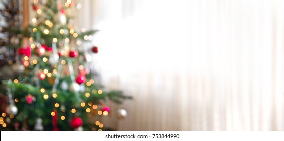 out of focus holiday background with christmas tree