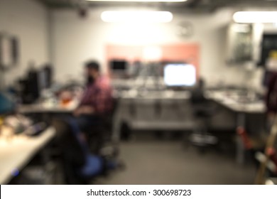 Out Of Focus Shot Of Technician Working In A Computer Repair Shop