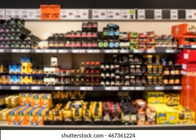 Out Of Focus Supermarket Shelf With Coffee And Tea, Unrecognizable