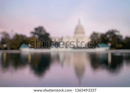 Out of Focus of The United States Capitol Building, seen from reflection pool on dusk. Washington DC, USA.