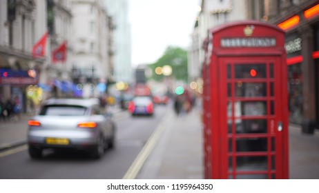 Out Of Focus View Of City Street In London With Phone Booth In Foreground