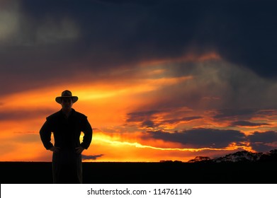 Outback cowboy at sunset