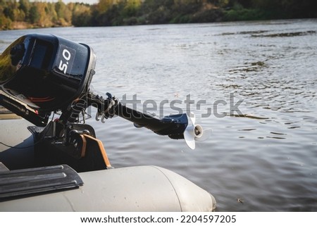 outboard motor on a boat over water