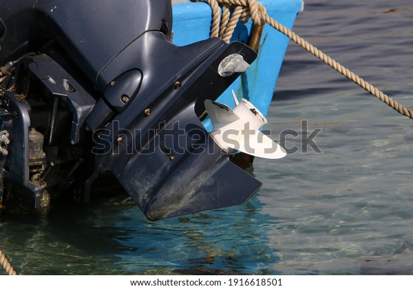 Outboard\
motor propeller. Boat in the port of Tel\
Aviv.