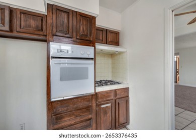 Outdated Kitchen with old cabinets and counters