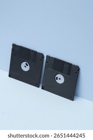 Outdated technologies. Retro 80s floppy disks on blue background. Creative layout