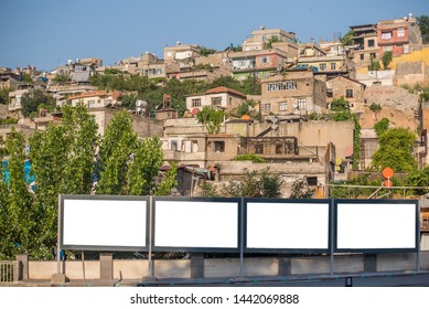 Outdoor Ads On A Poor Street. A Poor Slum