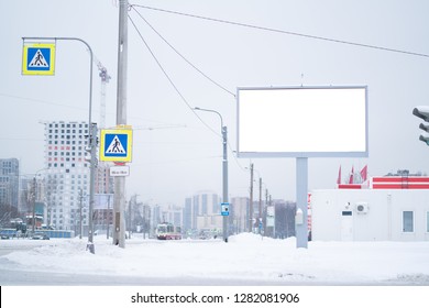 Outdoor Advertising Mockup Billboard. On The Street Of A Winter City Under The Snow.