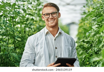 Outdoor, agronomist or man with tablet in portrait for plant research, crop production or info on agriculture. Nature, male scientist and digital for quality inspection, growth or tomato tree monitor - Powered by Shutterstock