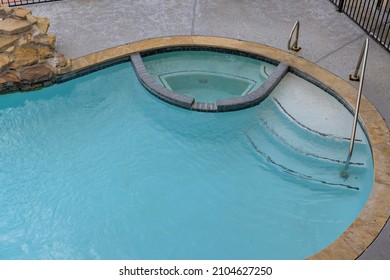 Outdoor In Backyard Swimming Pool Opening With Water Before Cleaning