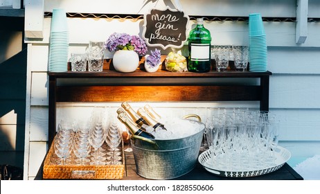 Outdoor Bar Cart With Champagne Bottles On Ice