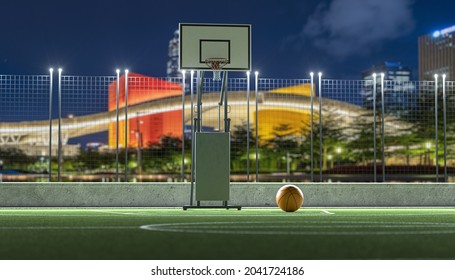 Outdoor Basketball Court In A Public At Night View Background