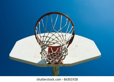 Outdoor basketball hoop, blue sky