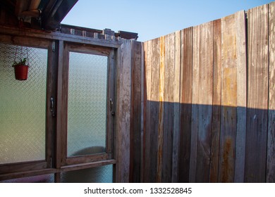 Outdoor Bathroom Made From Wooden Wall And Glass Window On Home Stay For Tourists To A Shower After The Tour.