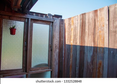 Outdoor Bathroom Made From Wooden Wall And Glass Window On Home Stay For Tourists To A Shower After The Tour.