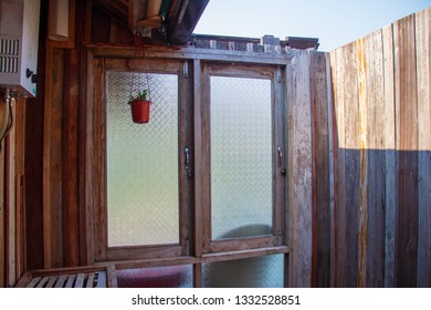 Outdoor Bathroom Made From Wooden Wall And Glass Window On Home Stay For Tourists To A Shower After The Tour.