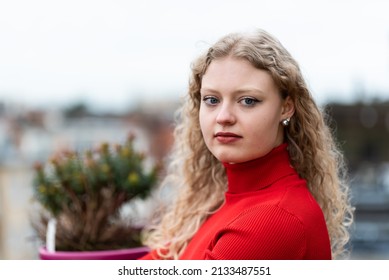 Outdoor Beauty Portrait Of A 21 Year Old White Blonde Woman With Curling Hair