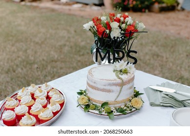 Outdoor Bridal Shower Cake And Bouquet Of Roses