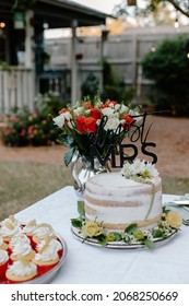 Outdoor Bridal Shower Cake And Bouquet Of Roses