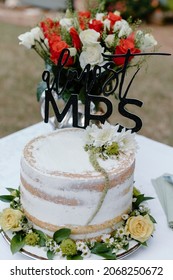 Outdoor Bridal Shower Cake And Bouquet Of Roses