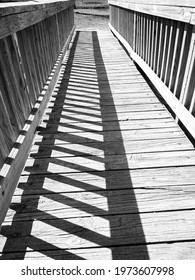 outdoor bridge with parallel shadows