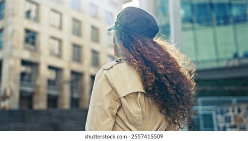 Outdoor, business and woman with commuting in city to workplace for job opportunity. Back view, female person and walk in street or downtown for traveling as professional occupation for career growth - Powered by Shutterstock