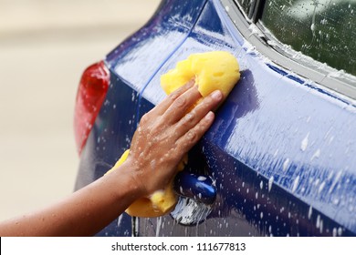 Outdoor Car Wash With Yellow Sponge