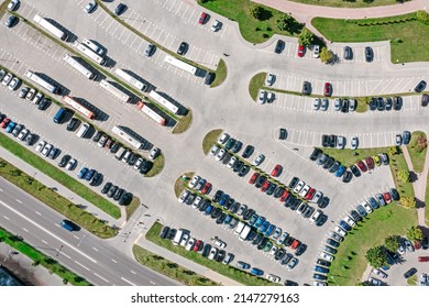 Outdoor Carpark With Rows Of Cars In Urban Landscape. Aerial Top View In Sunny Day.