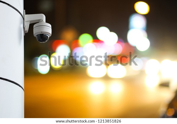 Outdoor CCTV monitoring at a road, security\
cameras at night.