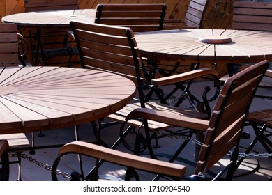 Outdoor chair and table with metal chain and lock. Coronavirus viral prevention. Café and social communication ban.