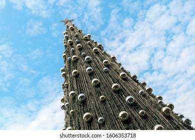 Outdoor Christmas Tree At Daytime With Beautiful Blue Sky