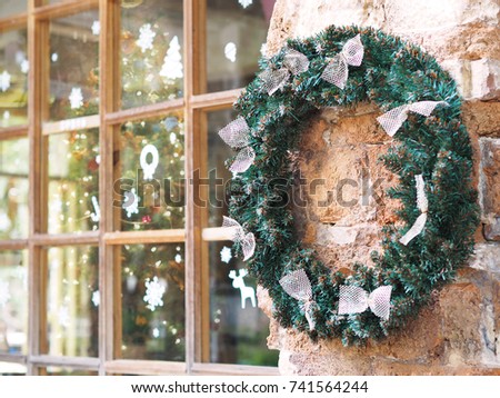 outdoor christmas wreath with bow ribbon hang on the concrete wall for window shop decoration - Outdoor Christmas Ribbon Decorations outdoor christmas wreath with bow ribbon hang on the concrete wall for window shop decoration - Outdoor Christmas Ribbon Decorations