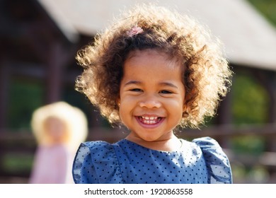 Outdoor Close Up Portrait Of A Cute Young Black Girl Smiling - African American Child