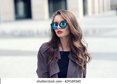 Outdoor Closeup Fashion Style Portrait Of Young Pretty Stylish Girl With Long Curly Hair Wearing Sunglasses