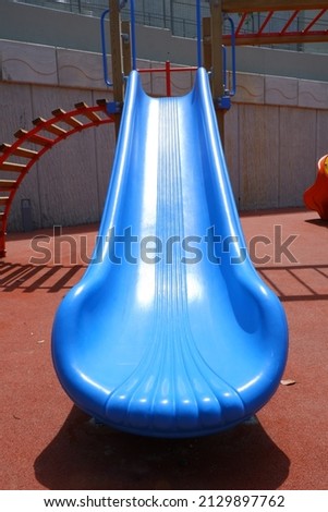 outdoor colorful children playground, blue slide